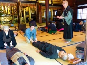 from Japan Times: Buddhist priest Issho Fujita instructs participants in a Zen meditation workshop| KYODO